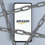 Smartphone with e-commerce logo wrapped in metal chains