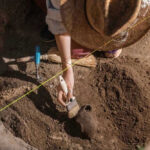 AMAZING: Medieval Monastery Found WHERE? Archaeologist uncovering pottery at a dig site.