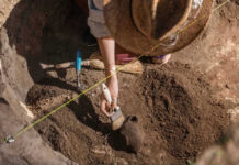 AMAZING: Medieval Monastery Found WHERE? Archaeologist uncovering pottery at a dig site.