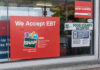 Store window displays EBT and SNAP acceptance signs