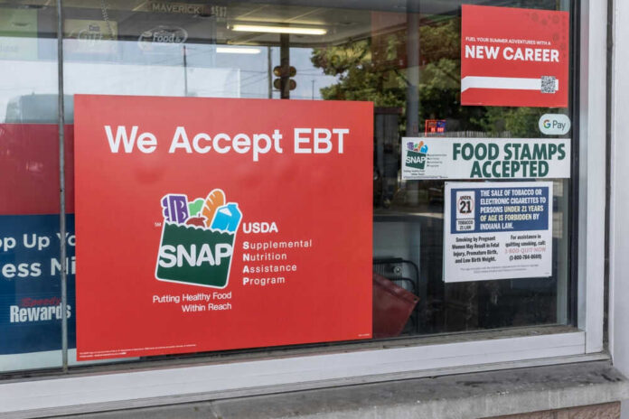 shutterstock_2341195625 Store window displays EBT and SNAP acceptance signs