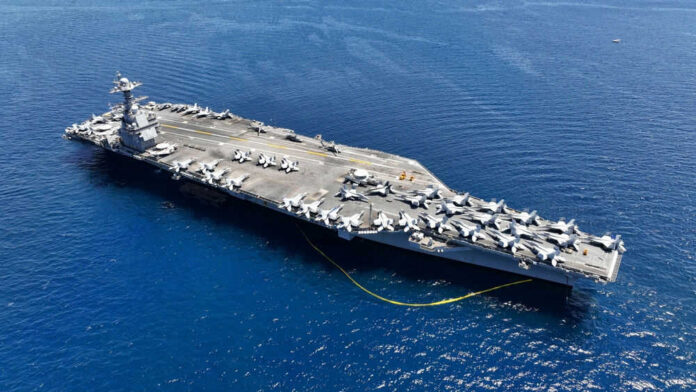 Aircraft carrier with planes in the ocean