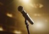 Close-up of a microphone on a stage with soft lighting