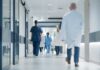 Common Hospital Treatment Tied To Higher Deaths Medical staff walking through a hospital corridor