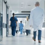 Common Hospital Treatment Tied To Higher Deaths Medical staff walking through a hospital corridor