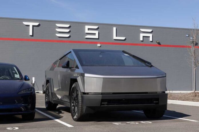 Indianapolis,-,February,28,,2025:,Tesla,Cybertruck,Display,At,A Tesla Cybertruck parked in front of a Tesla dealership