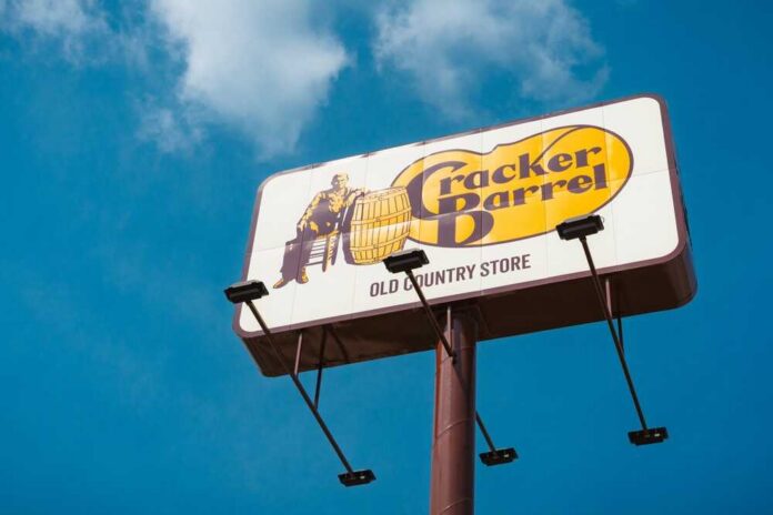 Sign for Cracker Barrel restaurant against a blue sky