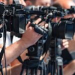 VIDEO: Rescue Armada Scrambles As Deadly Tragedy Unfolds television cameras on tripods at a media event