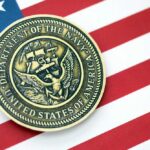 Navy Department seal on an American flag background