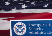 New TSA Mandate Shocks Airports Transportation Security Administration sign in front of an American flag