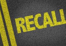RECALL: Pickup Truck Fire Risk Exposed Yellow 'RECALL' text on a dark asphalt surface