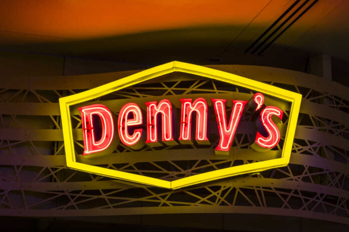Las,Vegas,-,Circa,July,2017:,Neon,Logo,And,Signage Dennys sign illuminated against a twilight sky