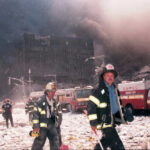 Firefighters at World Trade Center debris aftermath.