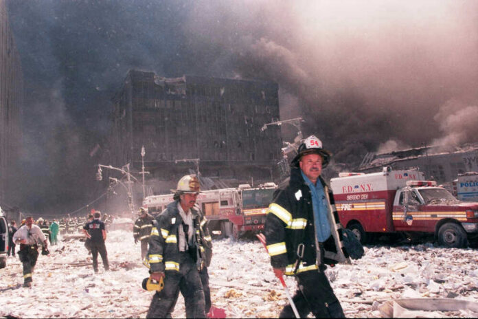 shutterstock_99057281 Firefighters at World Trade Center debris aftermath.