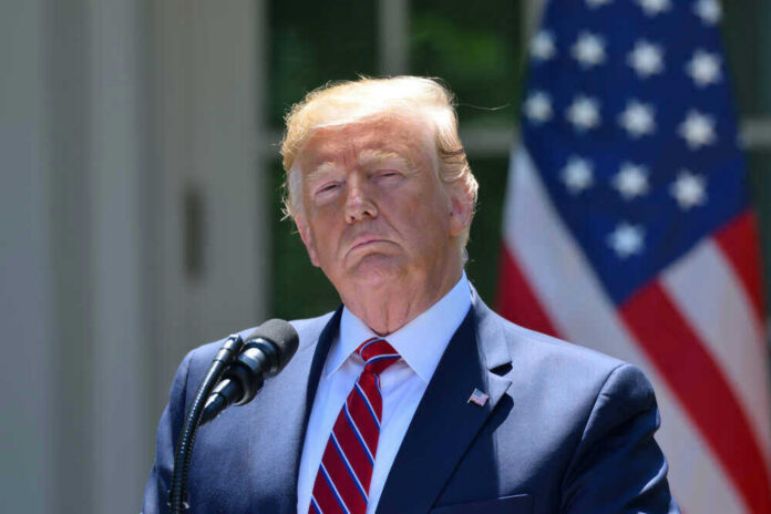 Donald Trump at a podium with a U.S. flag in the background