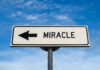 Balcony Horror: Baby Survives Road sign pointing left saying miracle