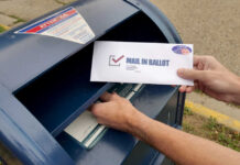 Ballot Brawl Erupts – Brakes Slammed Hands mailing a ballot envelope into a blue mailbox