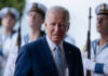 Biden Prosecutor Under FBI Heat Joe Biden stands in front of uniformed honor guards