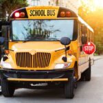 Fatal Drift Triggers Bus Rollover – VIDEO Yellow school bus with stop sign extended on a suburban street