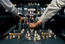 Chilling Plot Stuns Investigators (Video) Pilots operate controls in an airplane cockpit