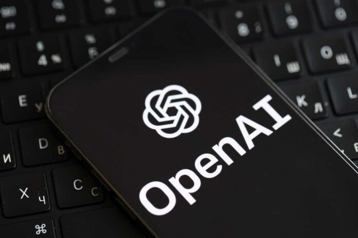 Smartphone displaying OpenAI logo on a keyboard