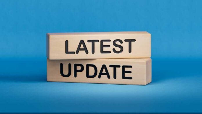 Wooden blocks with the words latest update on blue background