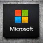 Microsoft logo displayed on a textured wall