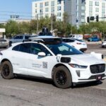 A Waymo autonomous vehicle driving in an urban area