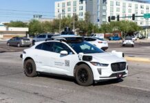 A Waymo autonomous vehicle driving in an urban area