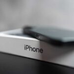 Smartphone resting on a retail box