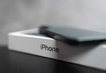 iPhone Duo Mayhem: January Or Bust Smartphone resting on a retail box