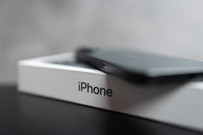 Smartphone resting on a retail box