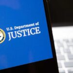 U.S. Department of Justice logo on a smartphone screen