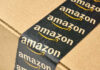 Urgent Amazon Baby Seat Recall Close-up of an Amazon-branded shipping box tape on a cardboard box
